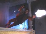 Nick Davis/David Brandt (Viggo Mortensen) launches himself across the bar, guns blazing.