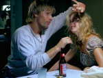 Clay shows off the bird egg he pulled from behind Callie's ear. (Viggo Mortensen, Ashley Judd)
