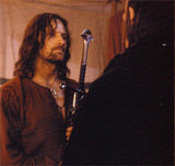 Aragorn receives the reforged sword from Elrond