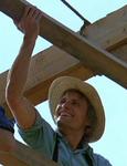 Moses Hochleitner (Viggo Mortensen) helping his Amish friends and relatives build the barn.