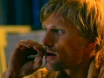 Viggo Mortensen as Clay in "The Passion Of Darkly Noon," smoking on the porch in the evening.