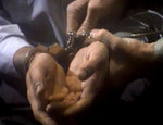 cuffed prisoner's hands